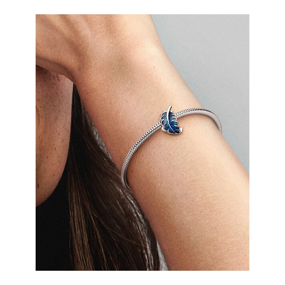Feather sterling silver charm with transparent blue enamel